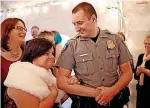  ??  ?? Oklahoma City police officer David Hanson escorts DeAnne Dalke on the red carpet.