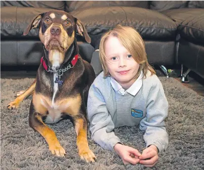  ?? Picture: Steve MacDougall. ?? Kind-hearted young lad: Dundee boy Max Pow, 10, with his dog TJ.