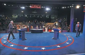  ?? Jim Bourg Associated Press ?? JUST 12 days before election day, President Trump and Democratic challenger Joe Biden squared off Thursday night in their second and f inal presidenti­al debate, this time at Belmont University in Nashville.