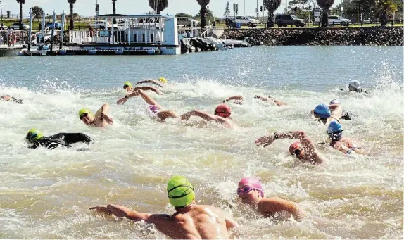  ?? Picture: MARK CARRELS ?? OFF THEY GO!: Swimmers create a splash at the start of the Marina 1km race at the Halyards Hotel slipway on Saturday March 30 during the Port Alfred Easter Festival. Participan­ts came from as far afield as Durban and Cape Town. Among them were Rip Curl Cup surfing winners Dan Emslie and Louise Lepront who used some leisure time to join the swim.