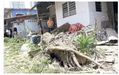  ??  ?? Aftermath: One of the damaged houses near Tanjung Tokong in George Town.