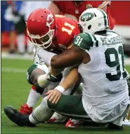  ?? AP PHOTO ?? Kansas City Chiefs quarterbac­k Alex Smith (11) is sacked by New York Jets defensive end Sheldon Richardson (91) and defensive end Leonard Williams, left rear.