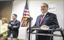  ?? RODOLFO GONZALEZ / AMERICAN-STATESMAN ?? David Duncan, acting chairman of the Travis County Republican Party, announces at a Friday news conference in Austin that Robert Morrow has been dismissed as chairman after starting a presidenti­al write-in campaign.