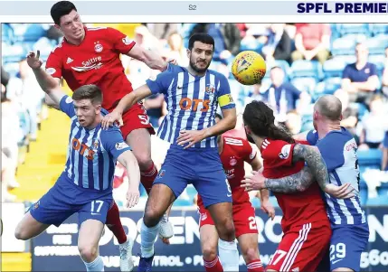  ??  ?? RED ALERT: McKenna rises highest to head home what proved to be the only goal at Rugby Park in the 66th minute