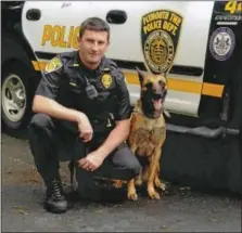  ??  ?? Officer Brad Fox with his K-9 partner, Nick.