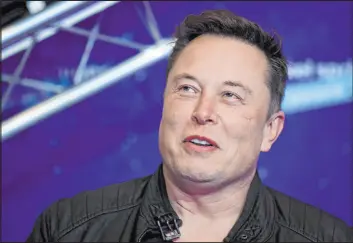  ?? Hannibal Hanschke The Associated Press file ?? A federal judge in California has dismissed a securities fraud and defamation lawsuit on Thursday that a Tesla investor had filed against CEO Elon Musk.