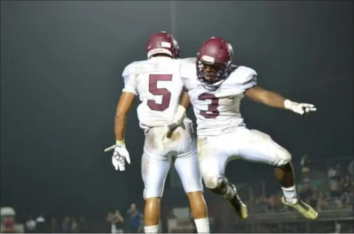  ?? THOMAS NASH - DIGITAL FIRST MEDIA ?? Pottsgrove’s Isaiah Taylor (3) celebrates with Isaiah Glover (5) after rushing for a 51-yard touchdown during Friday night’s win over Boyertown.