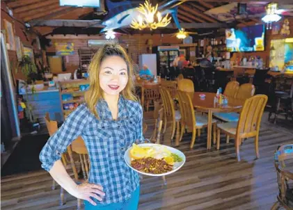  ?? NELVIN C. CEPEDA U-T PHOTOS ?? Mary Khuu and her husband took over the Lake Wohlford Café in February 2020, weeks before the pandemic closures.