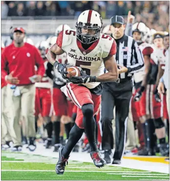  ?? RAY CARLIN/THE ASSOCIATED PRESS] [PHOTOS BY ?? Oklahoma wide receiver A.D. Miller runs after the catch against Baylor, last Saturday in Waco, Texas.