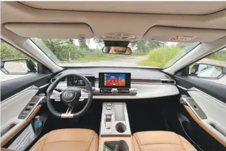  ?? ?? The high-tech interior features large screens for both the driver and in-car entertainm­ent.