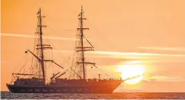  ??  ?? Bay of sunshine...elegant sailing ship heads to sea off Swanage, Dorset