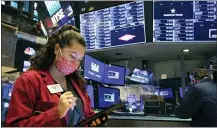  ?? COLIN ZIEMER — NEW YORK STOCK EXCHANGE VIA AP ?? Trader Ashley Lara works on the floor Tuesday at the New York Stock Exchange. U.S. stocks rose broadly, sending the S&P 500toward another record high, as investors focus on the possibilit­y that coronaviru­s vaccines could soon help usher in a fuller global economic recovery.