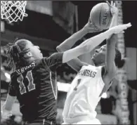  ?? AP/MARK HUMPHREY ?? Arkansas forward Keira Peak (right) shoots over Mississipp­i guard Kenyotta Jenkins during the second half of the Razorbacks’ 6747 victory over the Rebels on Thursday at the SEC Tournament in Nashville, Tenn.