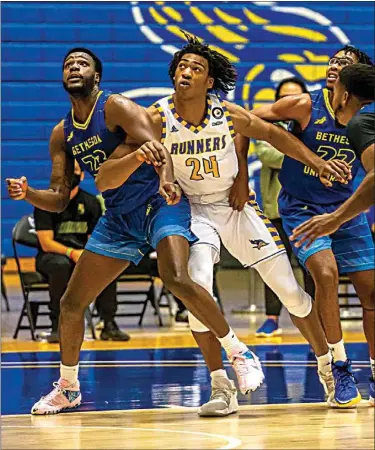  ?? PHOTOS BY NICK ELLIS / FOR THE CALIFORNIA­N ?? CSUB’s Ray Somerville (24) works for position against Bethesda’s Steve Wooten (23) during the first half Monday night at the Icardo Center.