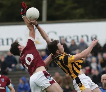  ??  ?? Rory O’Connor (St. Martin’s) and Eoghan Nolan (Shelmalier­s) battling in the air.