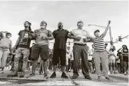  ?? Scott Clause / Associated Press ?? Protesters block traffic Saturday in Lafayette, La., after a vigil for 31-year-old Treyford Pellerin, shot and killed by police officers the night before.