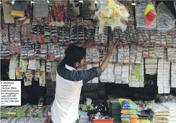  ?? AFP ?? A wholesale market in Chennai. Many small businesses are struggling to cope with GST since its launch on July 1 last year