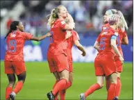  ?? Alessandra Tarantino / Associated Press ?? The USA’s Samantha Mewis, center, and her teammates celebrate her goal against Thailand on Tuesday.