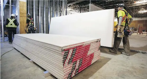  ?? JEFF MCINTOSH ?? Anti- dumping duties on U. S. drywall imports into Western Canada have hiked prices for the product, but have also resulted in new manufactur­ing jobs in Canada, says the company whose complaint prompted the trade tariffs.