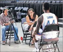  ?? [JIM BECKEL/ THE OKLAHOMAN] ?? Oklahoman columnist Jenni Carlson interviews Thunder forward Talib Zanna before the 2014 season.