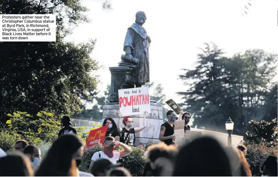  ??  ?? Protesters gather near the
Christophe­r Columbus statue at Byrd Park, in Richmond, Virginia, USA, in support of Black Lives Matter before it was torn down