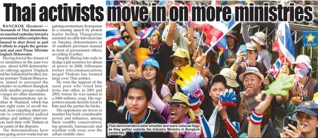  ??  ?? Thai demonstrat­ors blow whistles and wave national flags as they gather outside the Industry Ministry in Bangkok yesterday.
AP