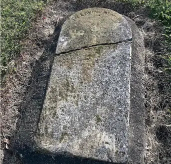  ?? ?? The headstone for Edward and Elizabeth Exelby of Nawton lies prone, rescued from its broken state by being set in concrete. Edward Exelby was well-known as a market gardener and orchardist.