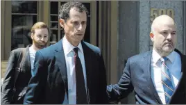  ?? Mary Altaffer ?? The Associated Press Former U.S. Rep. Anthony Weiner, left, leaves federal court in New York after pleading guilty in May to a charge of transmitti­ng sexual material to a girl, 15.