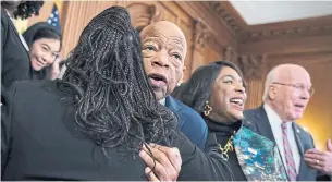  ?? J. SCOTT APPLEWHITE THE ASSOCIATED PRESS FILE PHOTO ?? John Lewis joined House Democrats in 2019 before the Voting Rights Advancemen­t Act to eliminate potential state and local voter suppressio­n laws was passed. Lewis died Friday.