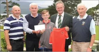  ??  ?? Christian Casey, Killarney Golf Club, celebrates a hole-in-one on the 4th round at Mahonys Point during the Kerry Junior League competitio­n at Killarney GC. He is pictured here with Mike McAuliffe and Ned Brosnan, Killarney Golf Club junior officers, Jack Buckley, Captain of the Federation of County Kerry Golf Clubs and Pat O’Dwyer, Kerry Junior Golf officer. Photo by Eamonn Keogh