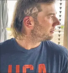  ?? @TrackingBu­rns/X ?? JUST ’DO IT: Sam Burns, who’s been working on his mullet for months, said he had a buddy shave USA into the hairdo with a straight edge.