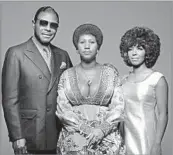  ?? Anthony Barboza Getty Images ?? FAMILY PORTRAIT The singer, center, is shown in 1971 with her father, C.L. Franklin, and sister-fellow singer, Carolyn.