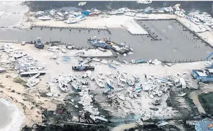  ?? COAST GUARD/COURTESY ?? Damage from Hurricane Dorian in the Bahamas is seen from a Coast Guard helicopter on Tuesday. The storm is beginning to move away from Florida.