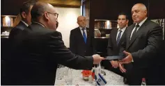  ?? (Yvette Shumacher) ?? LAURENCE WEINBAUM, national director of the Israel branch of the World Jewish Congress, personally delivers a letter from WJC president Ronald S. Lauder to Bulgarian Prime Minister Boyko Borissov.