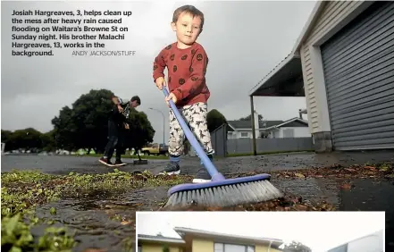  ?? ANDY JACKSON/STUFF ?? Josiah Hargreaves, 3, helps clean up the mess after heavy rain caused flooding on Waitara’s Browne St on Sunday night. His brother Malachi Hargreaves, 13, works in the background.