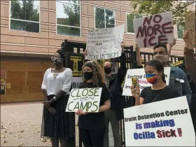  ?? ASSOCIATED PRESS FILE PHOTO ?? Dawn Wooten, left, a nurse at Irwin County Detention Center in Ocilla, Georgia, speaks at a news conference in Atlanta protesting conditions at the immigratio­n jail.