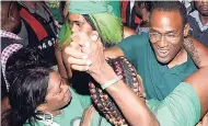  ?? FILE ?? Dr Nigel Clarke is swarmed by jubilant JLP supporters after winning the St Andrew North West seat.
