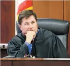  ?? LUIS SÁNCHEZ SATURNO/THE NEW MEXICAN ?? District Judge T. Glenn Ellington listens to opening statements Tuesday in the Aaron Dean Chavez trial on child molestatio­n charges.