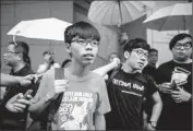  ?? Philippe Lopez AFP/Getty Images ?? JOSHUA WONG, left, and Nathan Law are among the three students charged in Hong Kong’s protests.