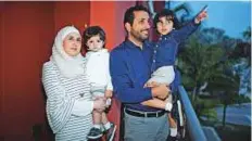  ?? Reuters ?? Mohammad Alala and his wife Dania with their two US born children Taim and Amr on the balcony of their home in Miramar, Florida, on Wednesday.