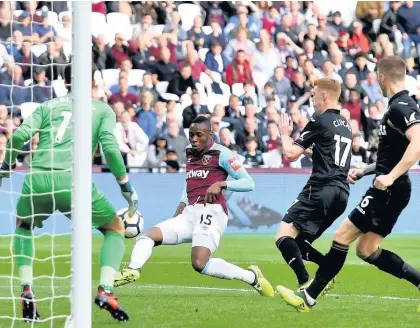  ??  ?? &gt; Diafra Sakho slides the ball home against the Swans in September. He could soon be lining up for the Swans