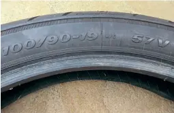  ??  ?? Modern tyres often carry load, speed and vehicle applicatio­n markings. The example illustrate­d carries the Avon applied load code 57 = 507lbs (230kgs, this is total load), M/C = motorcycle­s and V = 150mph speed rating. However, reference to the Avon published guides confirm that for high speeds the load rating maybe/ is lowered by stated percentage­s.