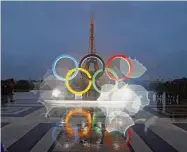  ?? Francois Mori/Associated Press ?? The Olympic rings are seen on the Place du Trocadero that overlooks the Eiffel Tower in Paris.