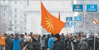  ?? BORIS GRDANOSKI/AP ?? Hundreds of Macedonian opposition supporters protest the change peacefully in front of parliament for a third day, demanding early elections and the dissolutio­n of parliament.