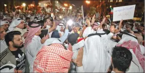  ??  ?? Kuwaiti demonstrat­ors take part in a demonstrat­ion against corruption in Kuwait City on Wednesday.