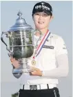  ??  ?? Sung Hyun Park hoists the trophy at Trump National Golf Club in Bedminster, New Jersey.