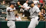  ?? Nam Y. Huh / Associated Press ?? The Yankees’ Joey Gallo, right, celebrates with Josh Donaldson after hitting a two-run home run against the White Sox in the ninth inning on Sunday.