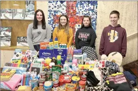  ?? Photo submitted ?? ECCSS students Madison Marzullo, Brandi Casper, Alya Glynn, and Marcus Gahr are shown with some of the items collected for the Crusader Kindness Closet.