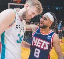  ?? ?? Jock Landale and Patty Mills catch up after San Antonio and Brooklyn squared off this month.