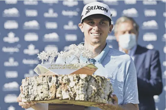  ??  ?? 2 John Catlin with the winner’s trophy after victory in the Andalucia Masters yesterday. Catlin became only the second American to win at Valderrama, following in the footsteps of Tiger Woods.